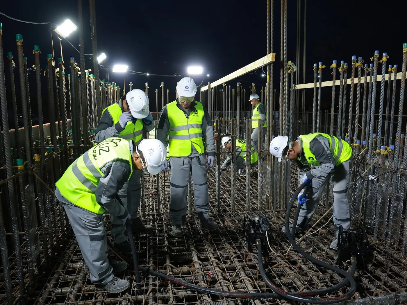 Rosatom and Uzatom employees pour concrete during a symbolic groundbreaking ceremony for Uzbekistan’s first nuclear power plant on June 4. Just three months later, it is clear that Uzbekistan is having second thoughts about its selection of Rosatom for this project.